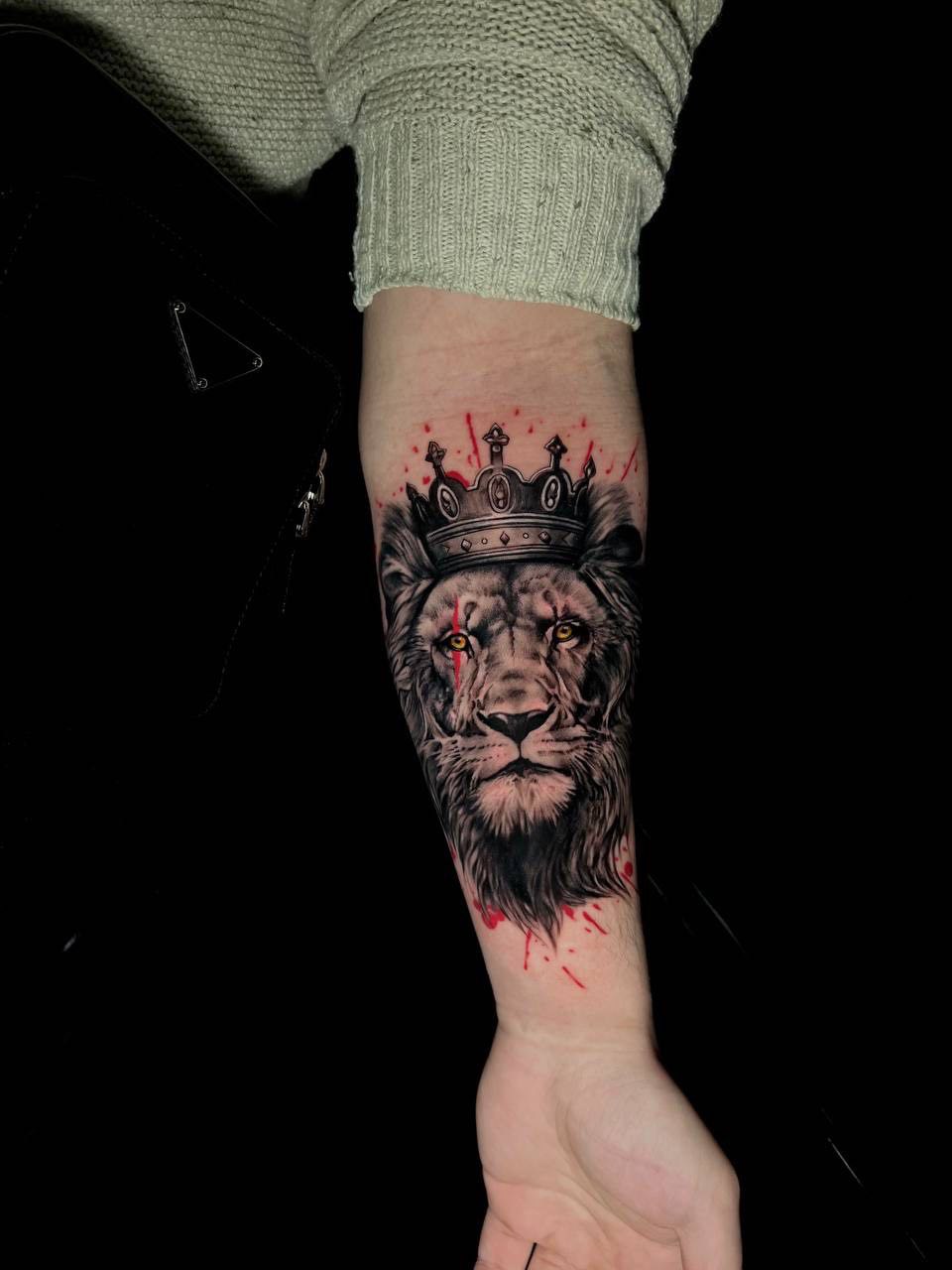 Crowned lion (king lion) forearm tattoo