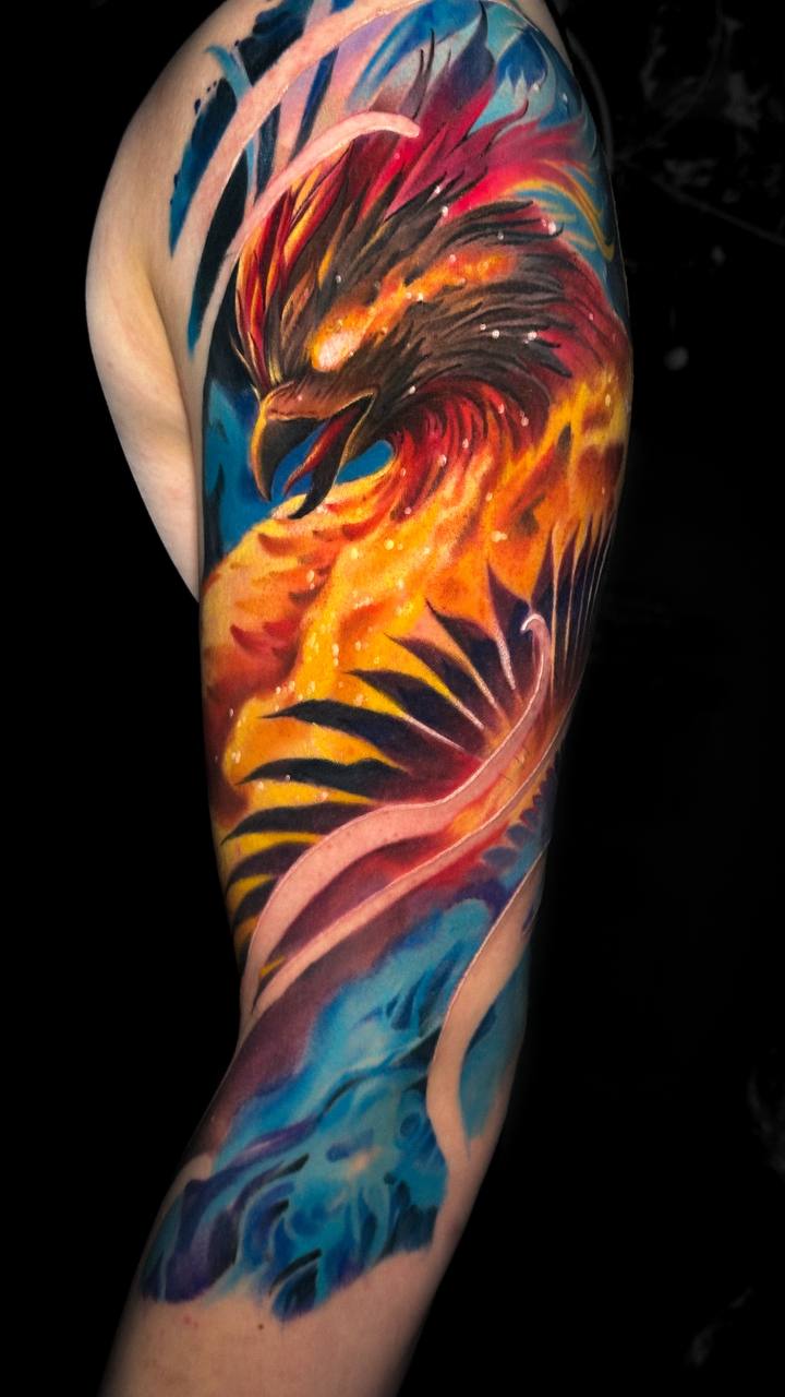 Colorful phoenix arm tattoo