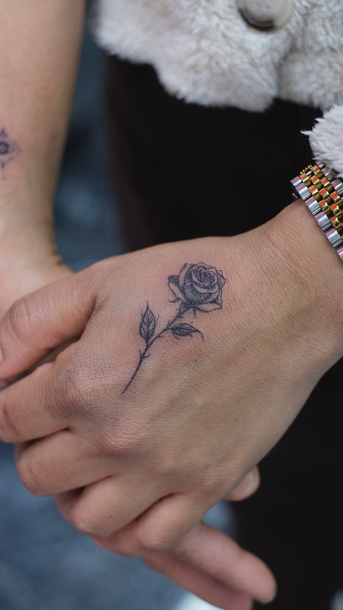 Fine Line Rose Hand Tattoo