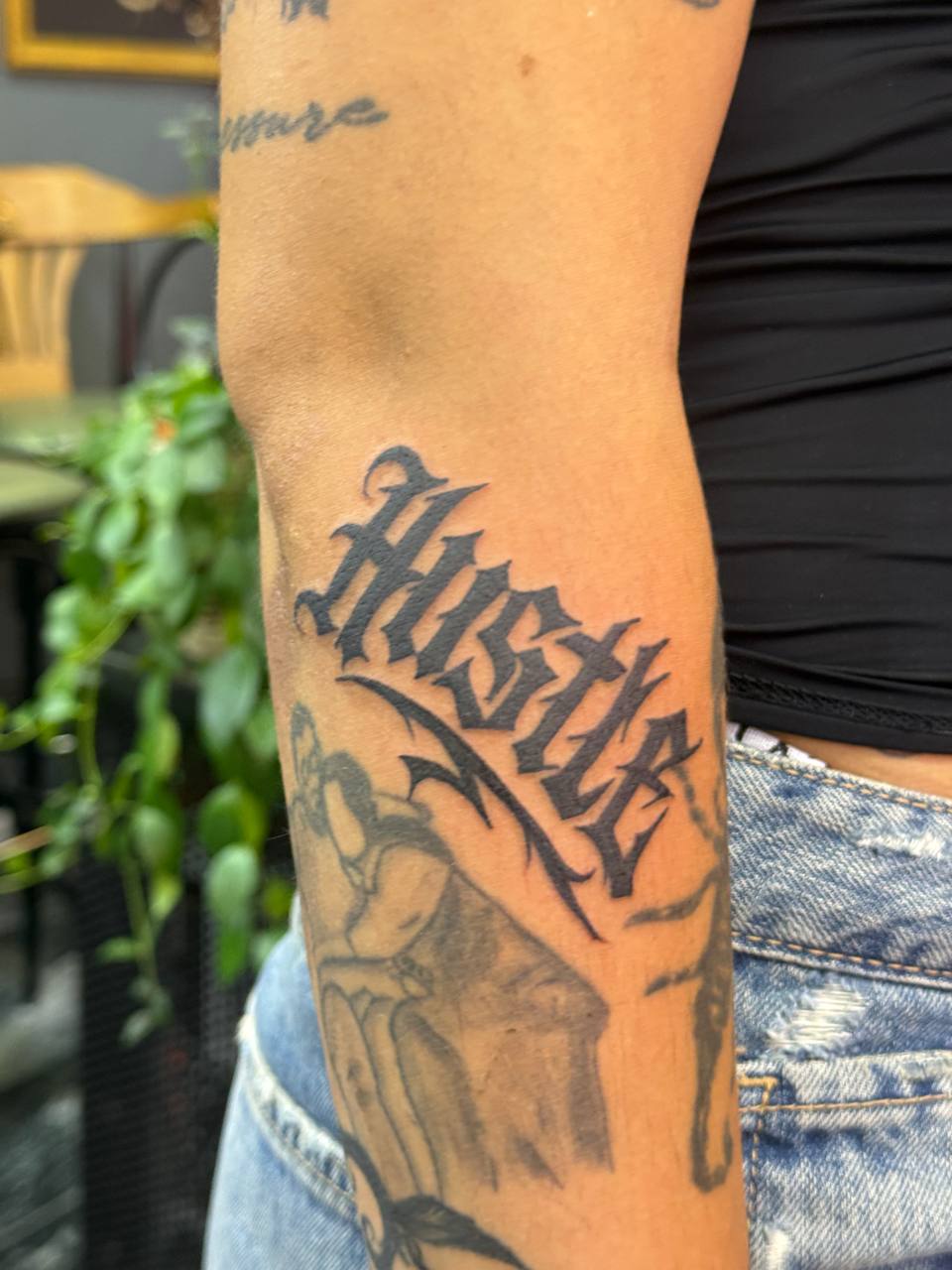 "Hustle" Lettering Arm Tattoo | Istanbul