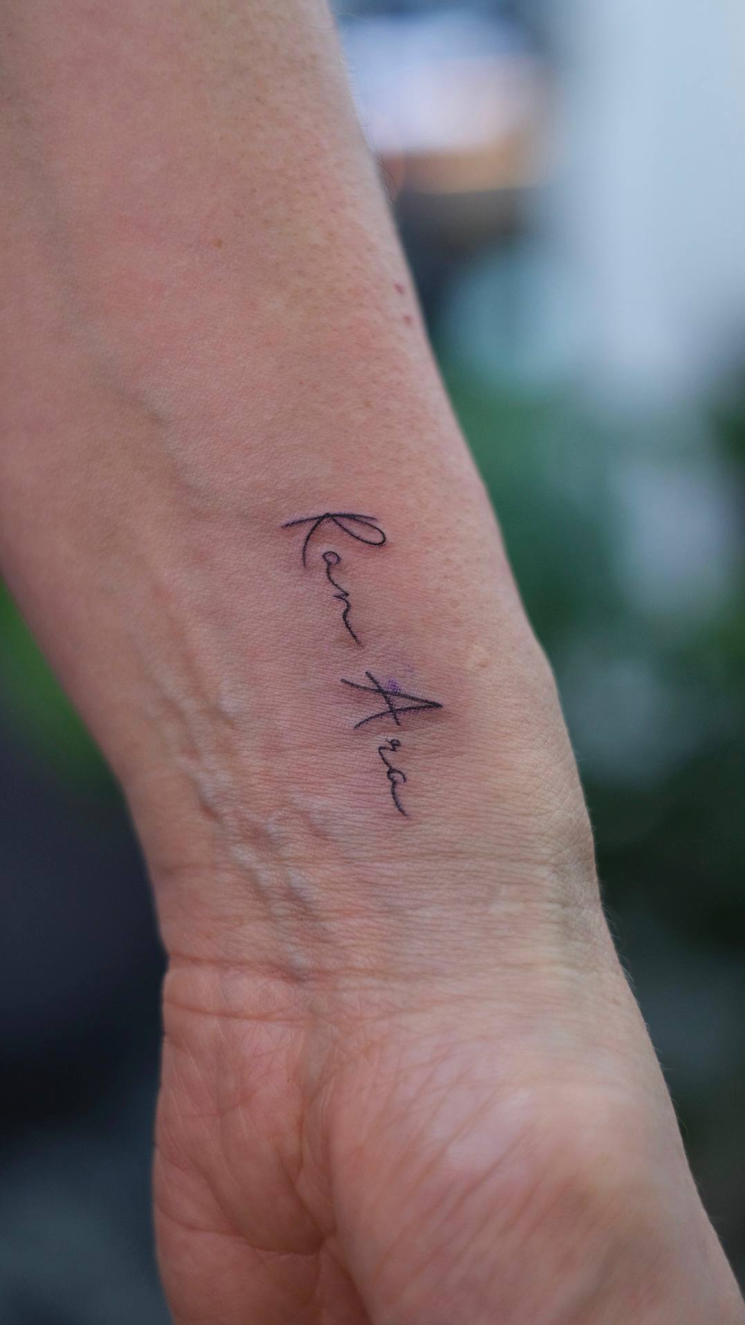Heartbeat Line Lettering Wrist Tattoo | Istanbul