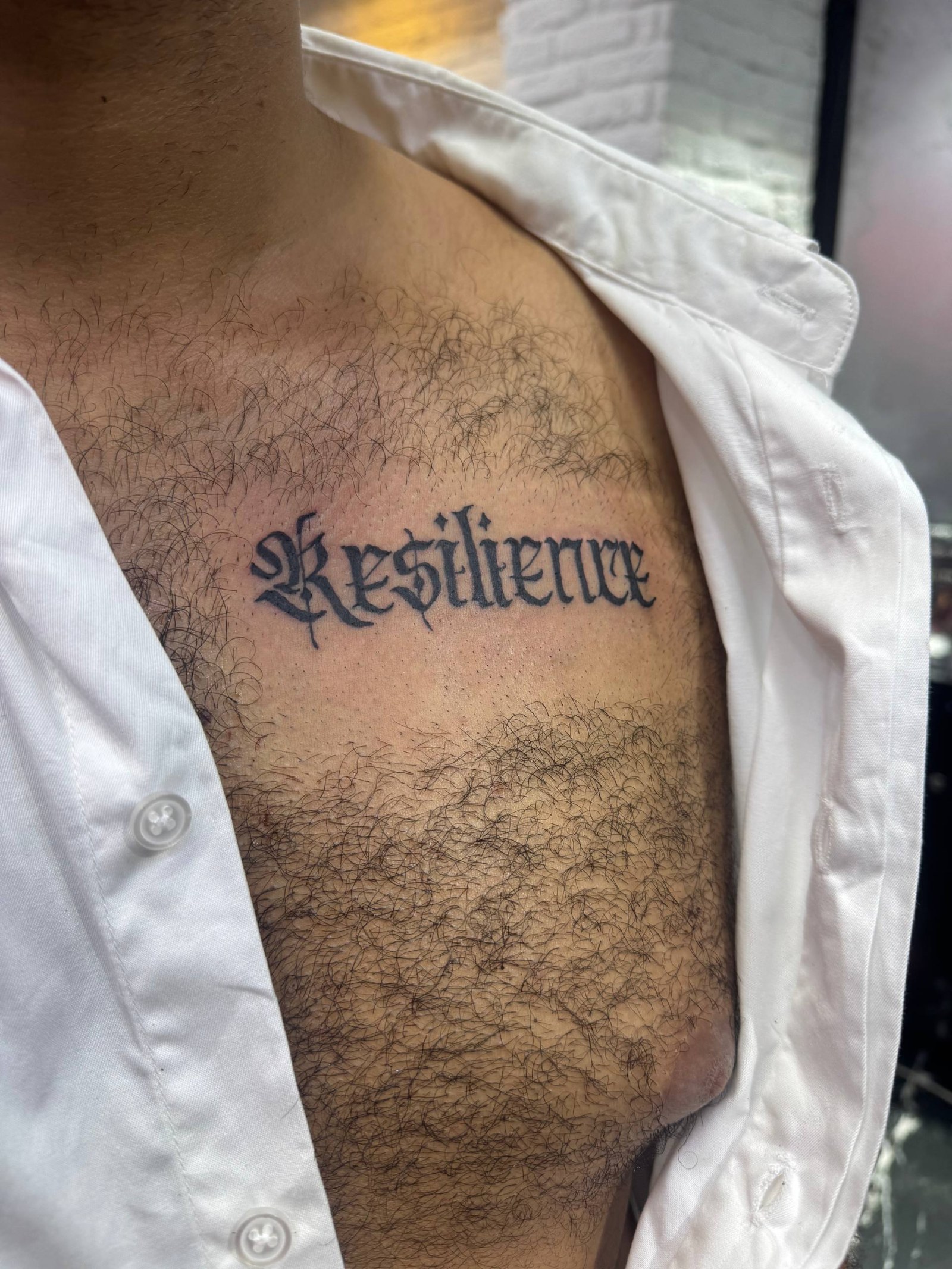 "Resilience" Lettering Arm Tattoo | Istanbul